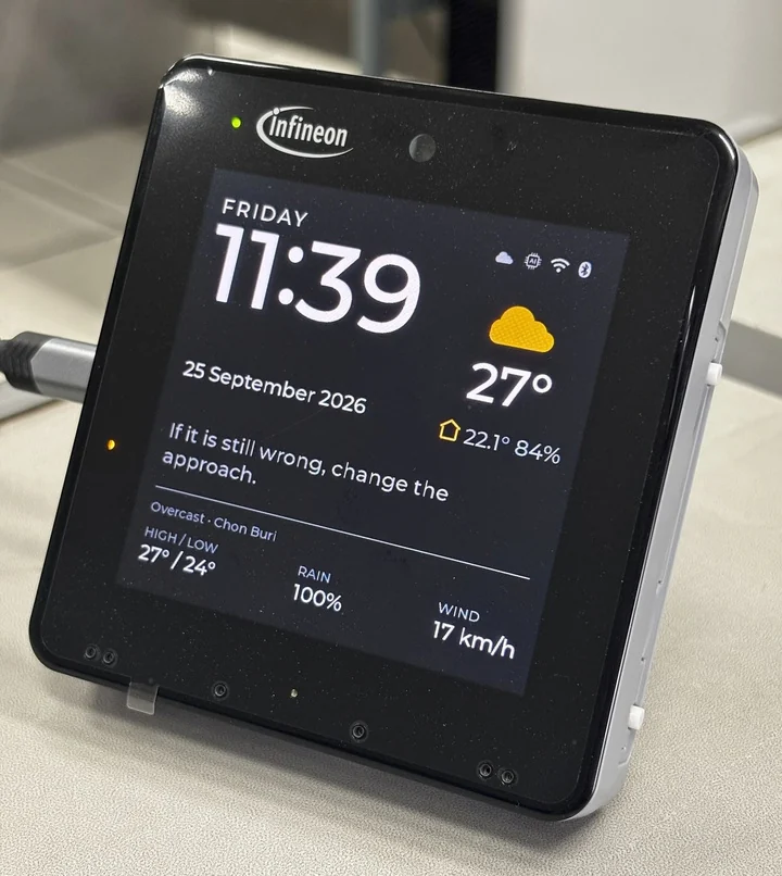 A BENTO device on the PSOC™ Edge E84 HMI kit showing a clock and weather face